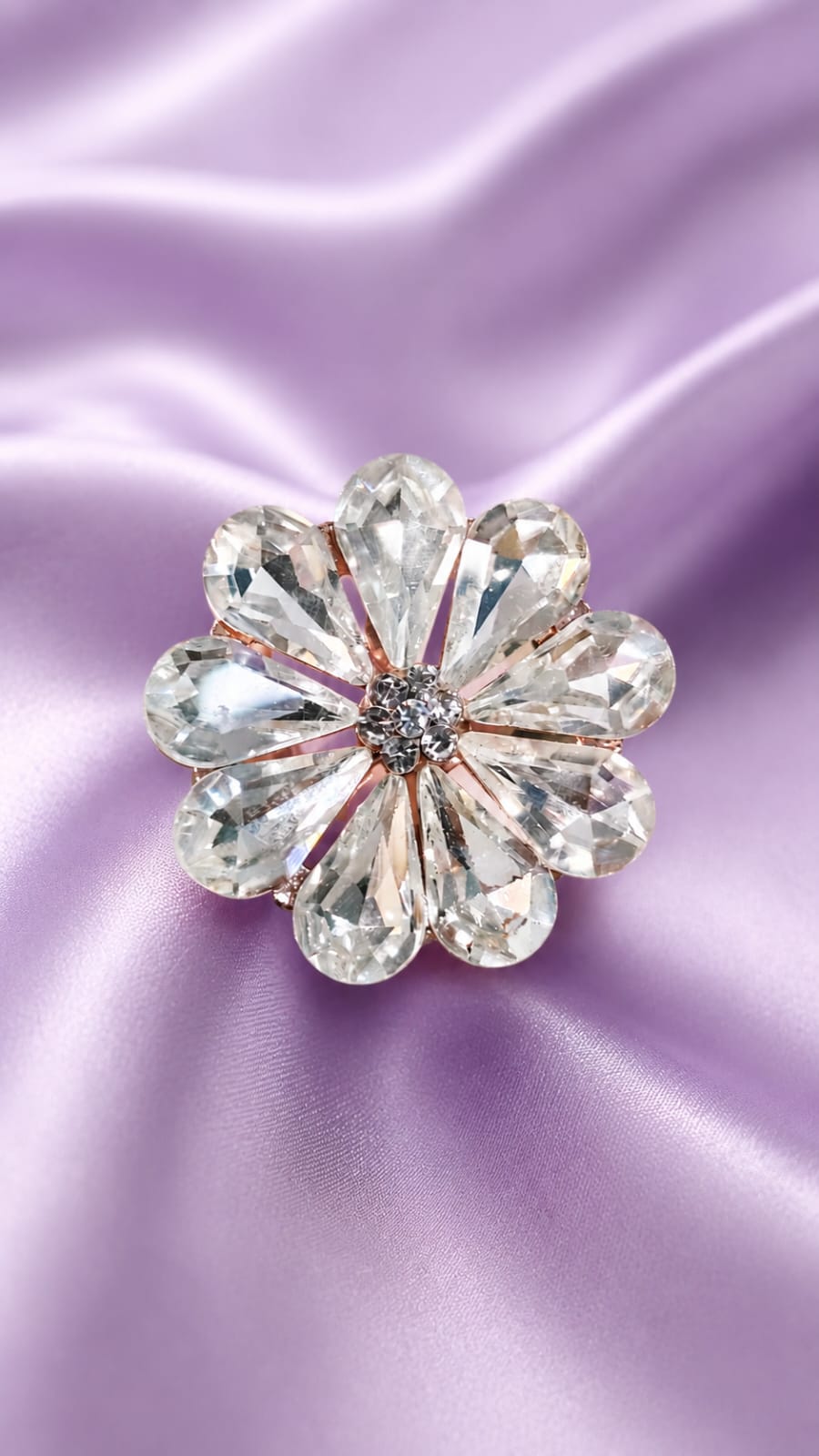 Crystal flower statement ring with clear round stones and centered dark detail