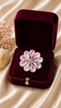 Blossom statement ring with pink flower centerpiece and silver-tone petals