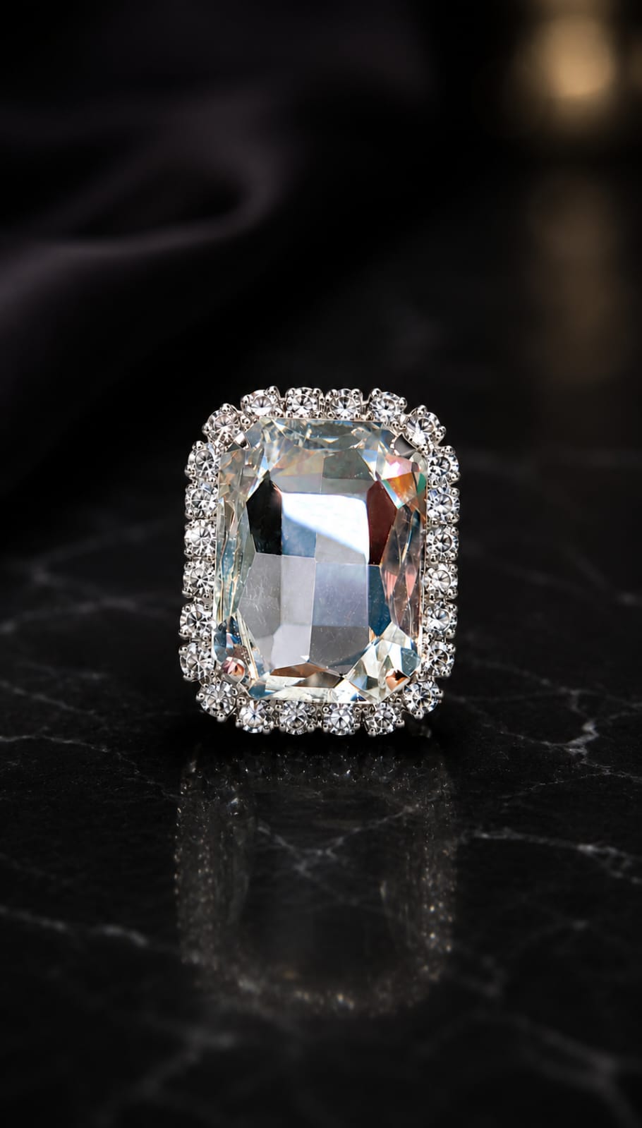 Crystal halo statement ring with a large faceted rectangular clear stone