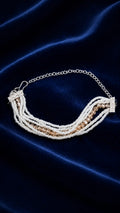 Multi-layer pearl and crystal bracelet with silver-tone chain and clasp