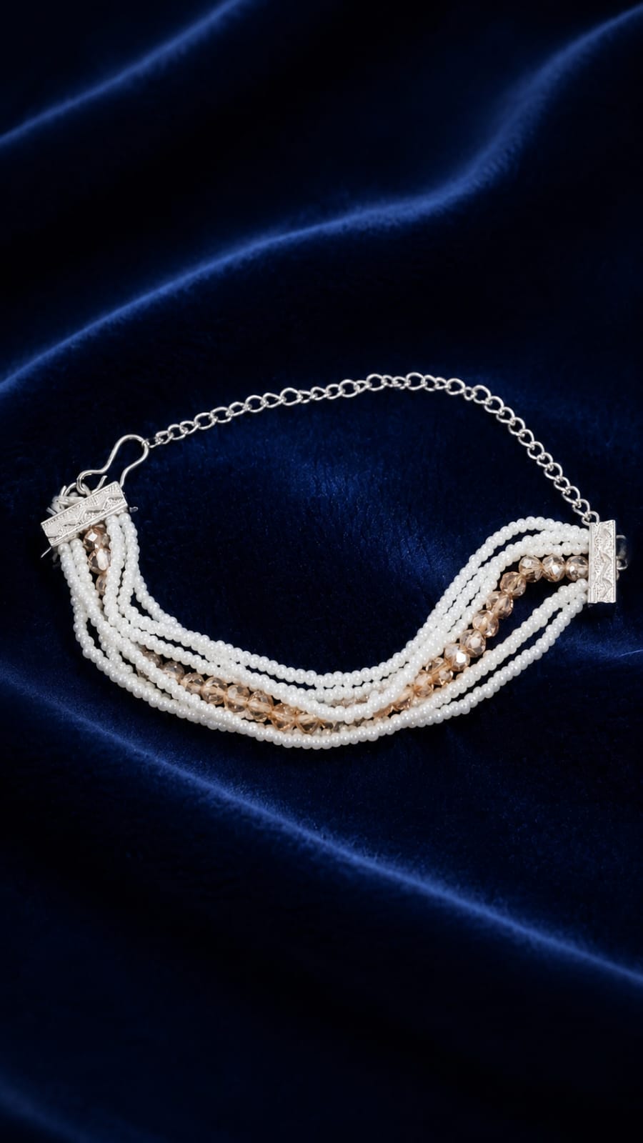 Multi-layer pearl and crystal bracelet with silver-tone chain and clasp