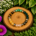 Crystal bracelet with green beads, tiger-eye stones and shiny gold-tone accents