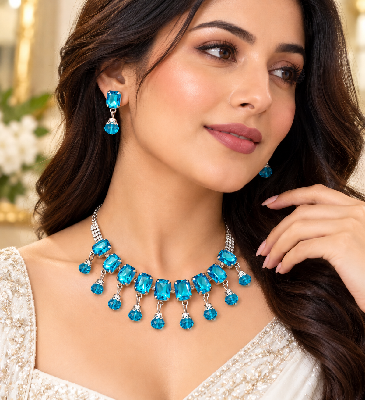 Turquoise drop earrings and matching stone necklace worn on model