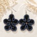 Handmade dark blue beaded flower earrings with silver hooks