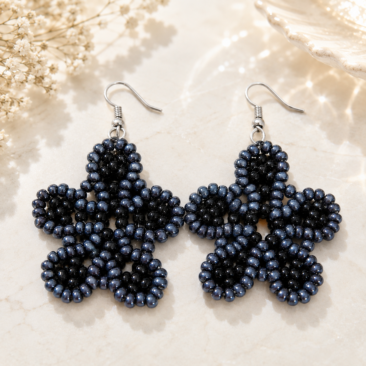 Handmade dark blue beaded flower earrings with silver hooks