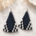Handmade beaded triangle drop earrings with navy and white beads, fishhook backs
