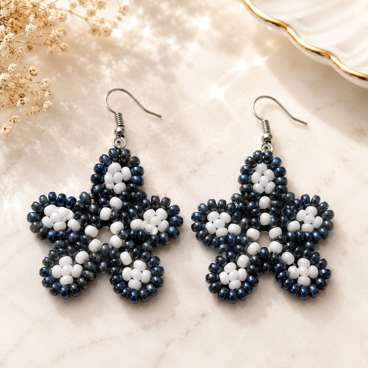 Midnight blue and white beaded floral drop earrings with star-shaped flower design