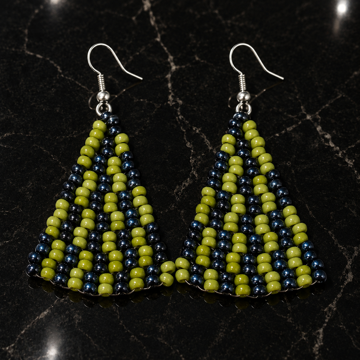 Handmade beaded triangle earrings with olive green and midnight blue stripes, silver hooks