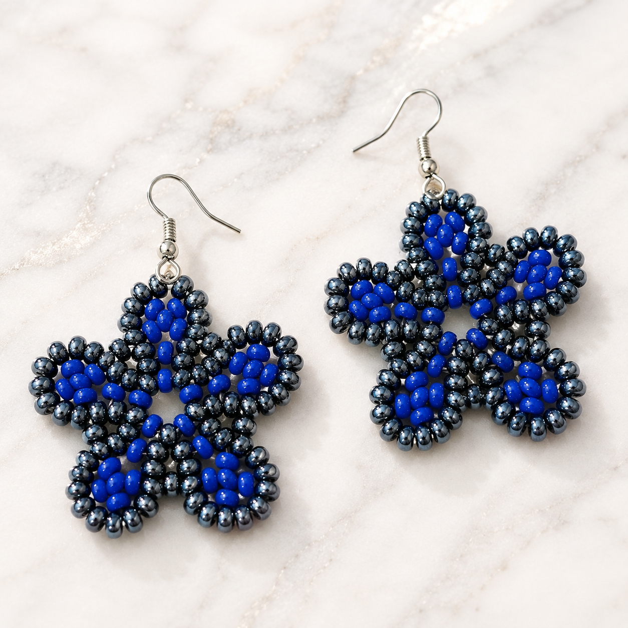 Handmade beaded floral earrings with royal blue and dark blue beadwork, silver hooks