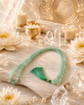 Green crystal bead mala necklace with green tassel and gold bead clasp