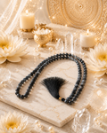 Labradorite crystal mala with dark gray bead strands and black tassel, prayer necklace