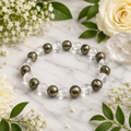 Clear quartz and pyrite beaded bracelet with round transparent and speckled beads
