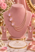 Rose gold-tone crystal necklace with round pendant links and matching drop earrings