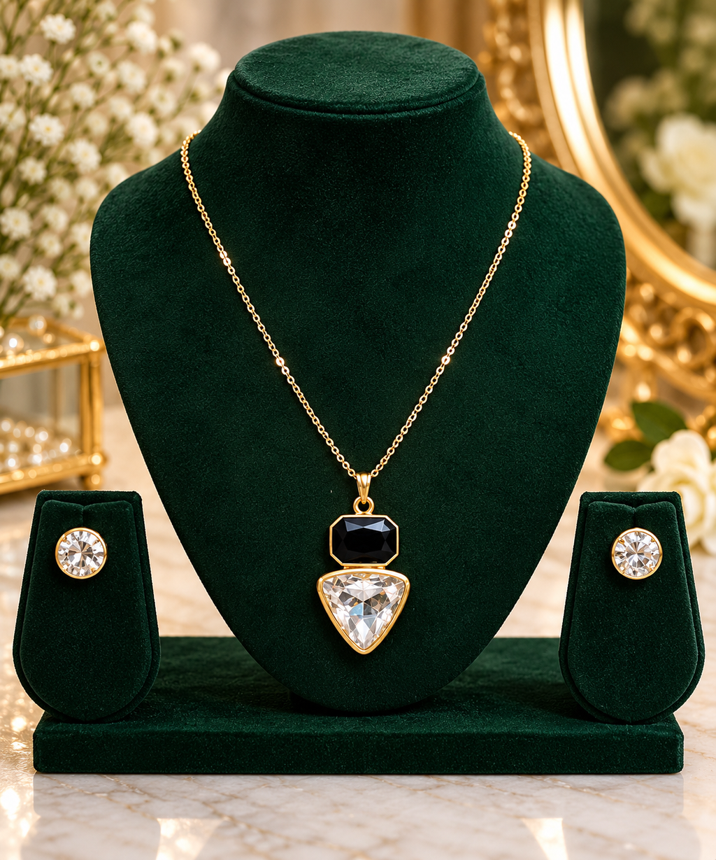Gold-tone geometric pendant necklace set with black square and clear teardrop stud earrings