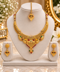 Gold-tone multicolour necklace set with maang tikka and matching drop earrings on stand