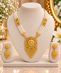 Gold-tone pearl multi-strand necklace with ornate pendant and drop earrings