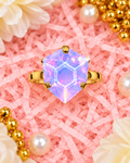 Iridescent lavender heart-shaped statement ring with gold-tone band and faceted crystal top