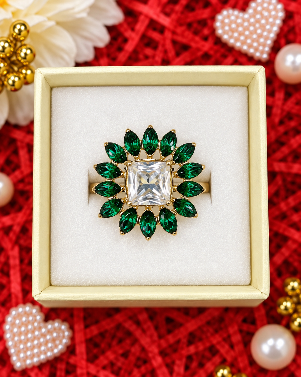 Gold statement ring with square crystal center and emerald-green floral stones