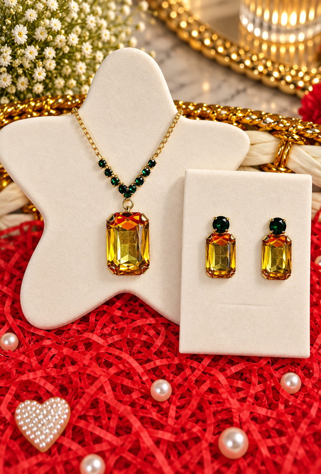 Gold-tone rectangular amber pendant necklace set with green accents and matching earrings