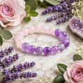 Amethyst and rose quartz crystal bracelet with alternating purple and pink round beads