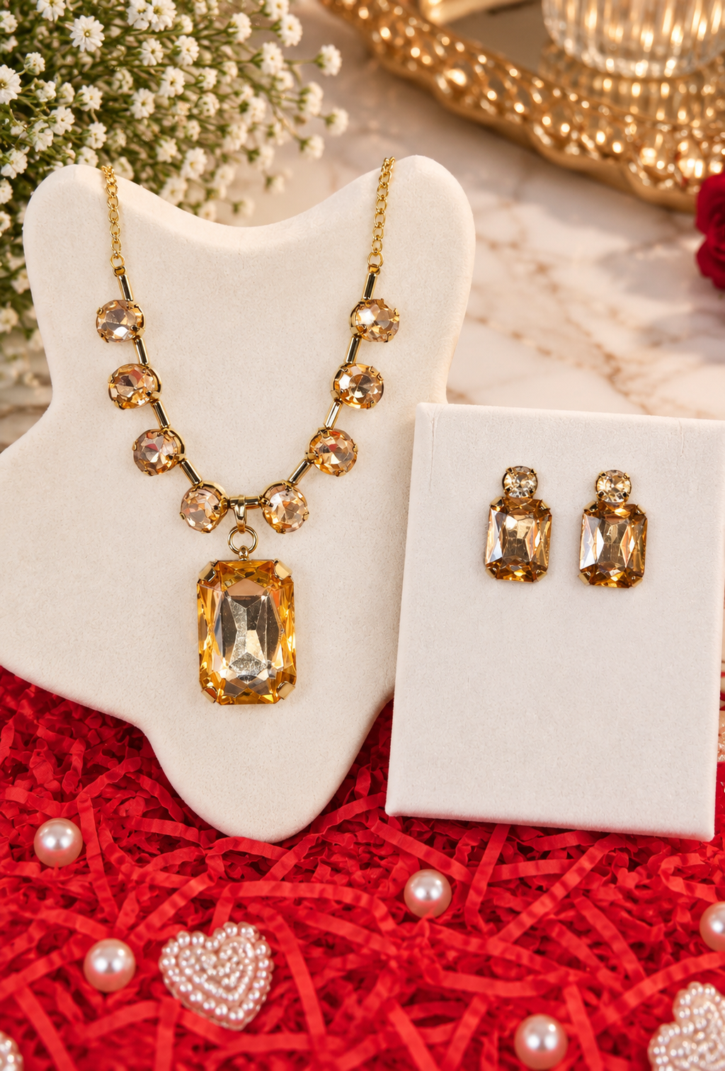 Gold-tone champagne crystal necklace with statement pendant and matching stud earrings