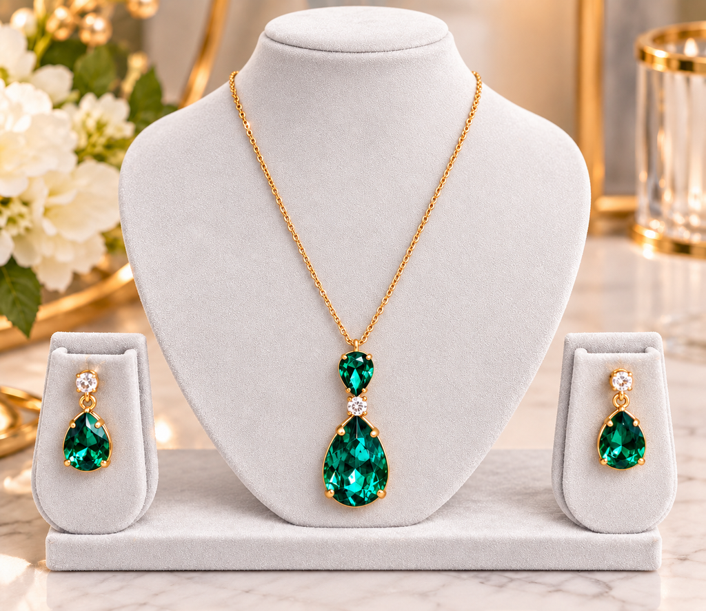 Teardrop pendant necklace set with emerald green stones and matching stud earrings