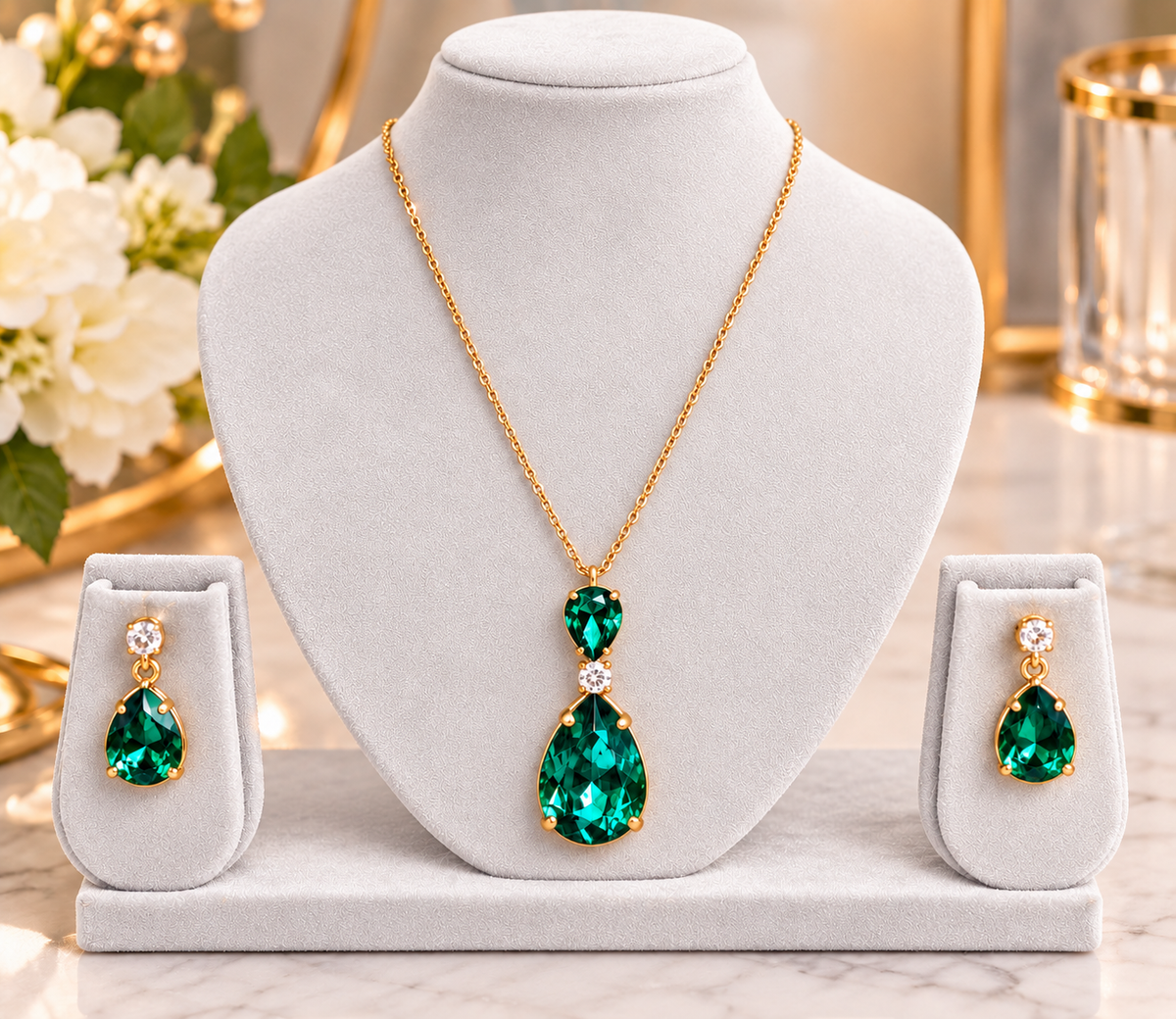 Teardrop pendant necklace set with emerald green stones and matching stud earrings