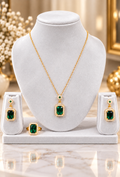 Rectangular green stone necklace set with gold-tone chain, stud earrings, and ring