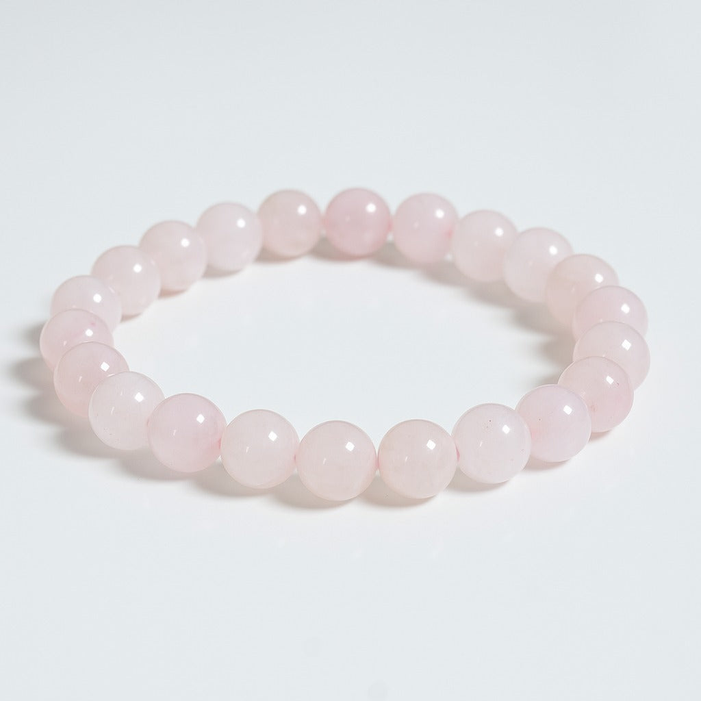 Rose quartz bead bracelet, pale pink round stones on a single strand