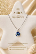 Evil eye pendant necklace with round blue enamel centerpiece and silver-tone chain