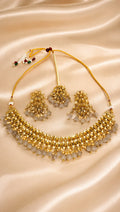 Gold-tone kundan and beaded necklace set with matching earrings