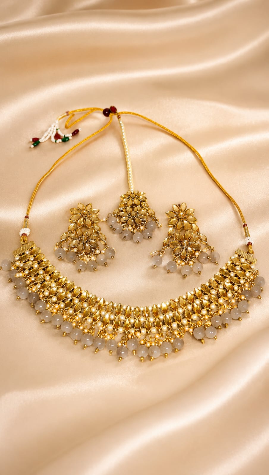 Gold-tone kundan and beaded necklace set with matching earrings