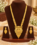Gold-tone filigree necklace with matching dangling earrings, triangular central pendant.
