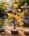 Citrine crystal tree ornament with golden yellow crystal branches on stone base